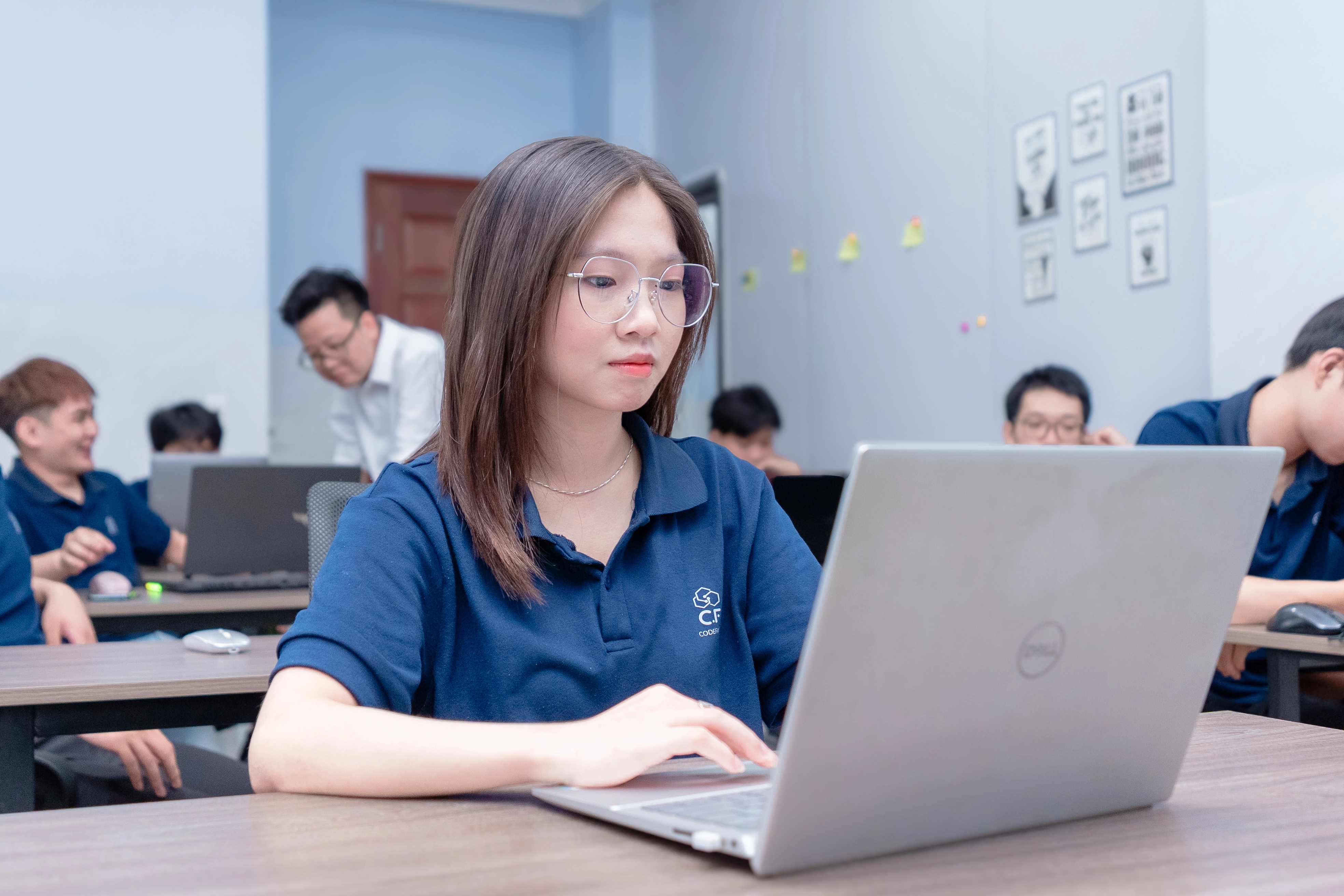 IT BA professional working at laptop in modern office
